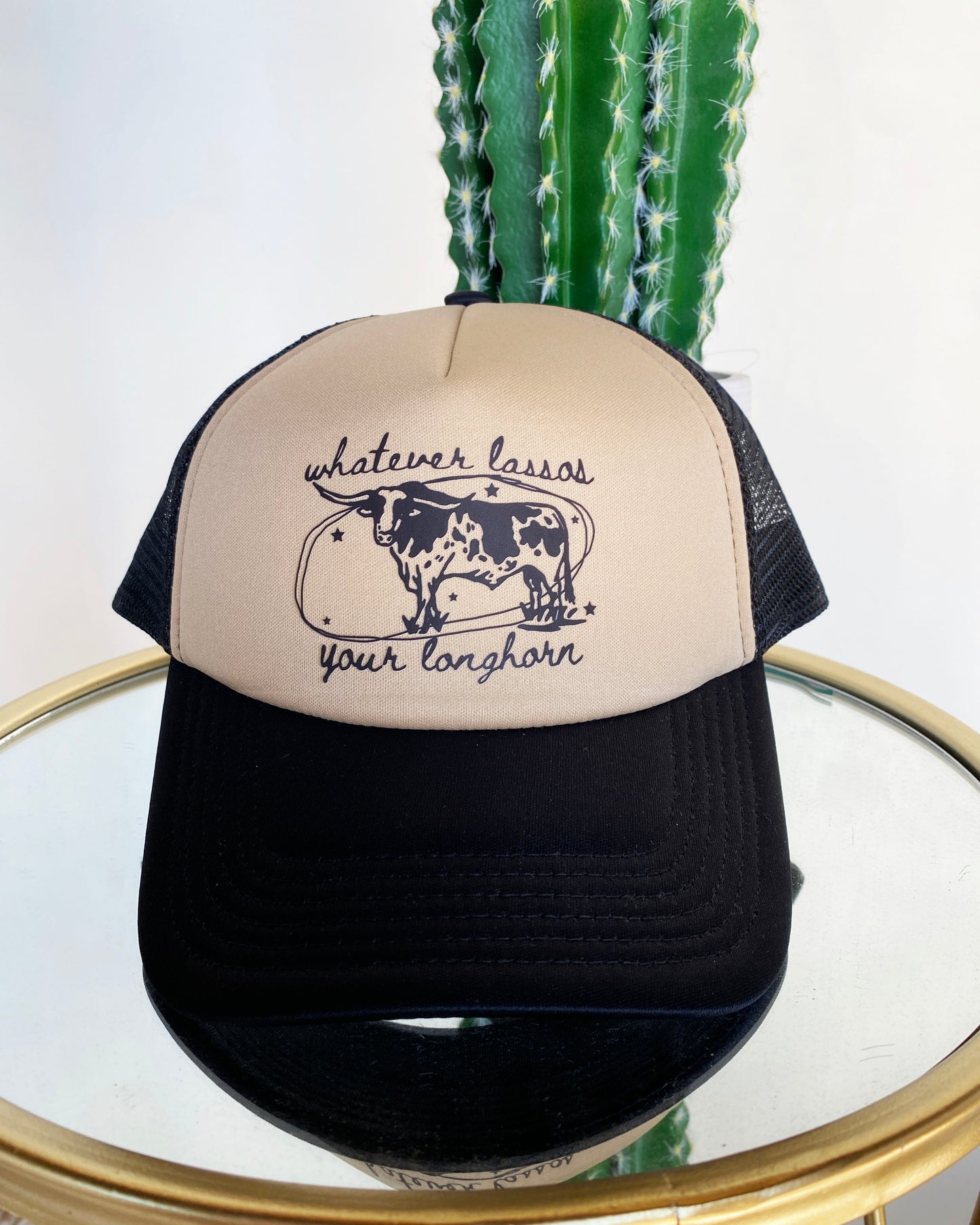 Whatever Lassos Your Longhorn Trucker Hat by Ali Dee - Black and Tan