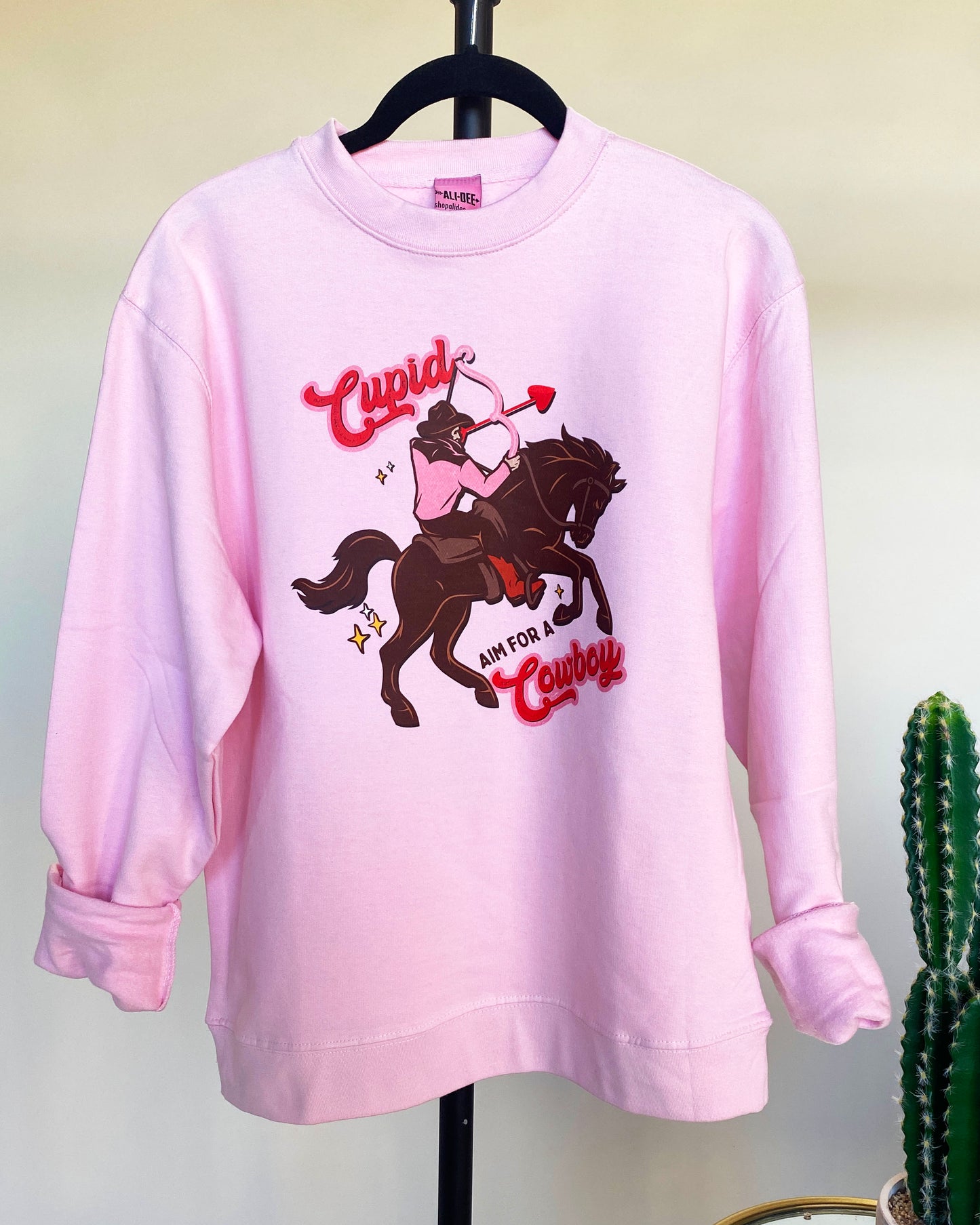 Cupid Aim for a Cowboy Graphic Sweatshirt - Pink