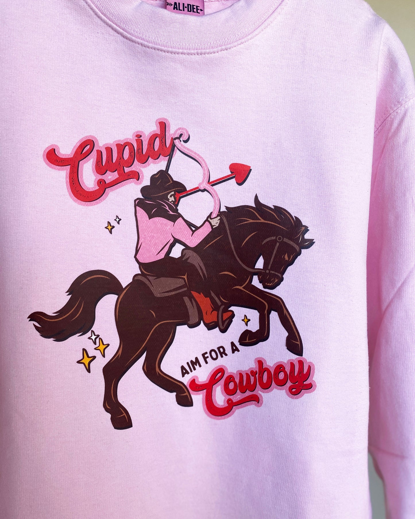 Cupid Aim for a Cowboy Graphic Sweatshirt - Pink